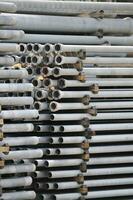 Stacks of Metallic Pipes photo