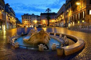 Fountain Barcaccia in Rome photo