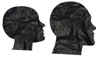 Silhouettes of heads cut out of black crumpled paper on a white background, elements for design photo