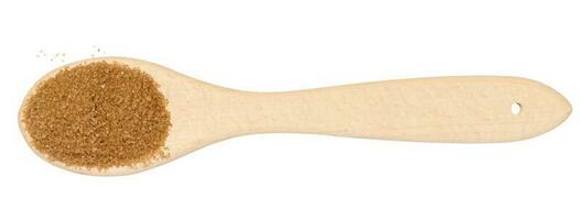 Wooden spoon with brown cane sugar on a white background, top view photo