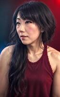 portrait photo of beautiful middle aged asian woman in dark room with light in background,