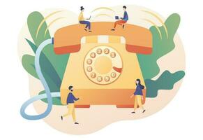 Big retro phone and tiny people. Phone Call. Incoming call concept. Communication device. Modern flat cartoon style. Vector illustration on white background