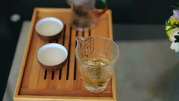 Chinese tea ceremony. Elite Chinese white tea splashes in a glass video