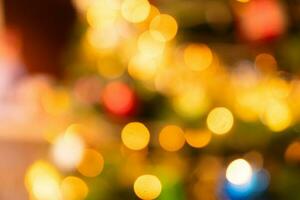 Bokeh of light on Christmas tree with decoration background. photo