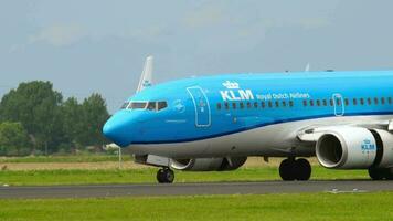 AMSTERDAM, THE NETHERLANDS JULY 27, 2017 - Boeing 737 of KLM braking after landing at Shiphol Airport, Amsterdam AMS. Tourism and travel concept. KLM planes at the airport, traffic video
