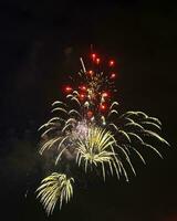 Night festive beautiful fireworks from different colors photo