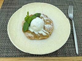 Hot pear pie with vanilla ice cream photo