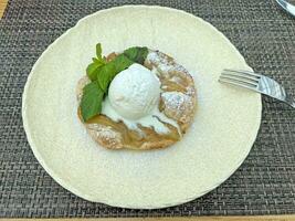 Hot pear pie with vanilla ice cream photo