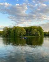 Pond in the forest with beautiful views and boating photo