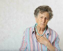 Old woman has a feeling of suffocation photo