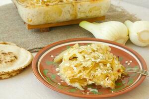 Healthy vegetarian dinner oven baked fennel bulbs with potatoes. photo