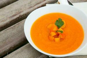 A plate of carrot soup photo