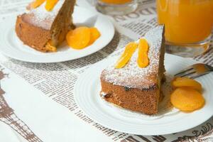 A piece of homemade apricot pie on the white plate photo