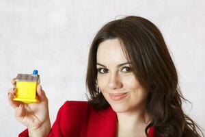 A lady keeps a small rubber house photo