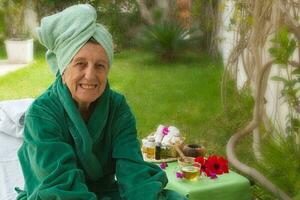 A senior in an open air spa studio photo