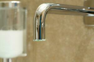 Limescale on a exterior surface of a tap photo