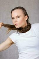 Young lady with long hair. Closeup. photo