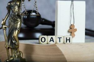 Word OATH composed of wooden letters. photo