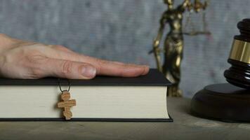 Wooden cross on a bible. Closeup photo