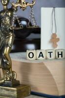 Word OATH composed of wooden letters. photo