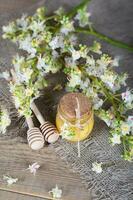 Chestnut honey on a wooden surface. photo