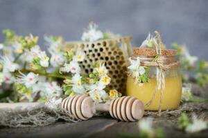 Chestnut honey on a wooden surface. photo