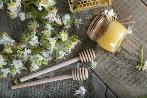 Chestnut honey on a wooden surface. photo