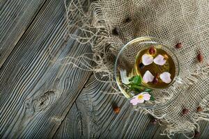 Rose hip herbal tea on a wooden surface. Free text. photo