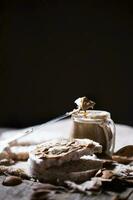 Homemade almond butter on a slice of rice crispbread. photo