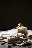 Homemade almond butter on a slice of rice crispbread. photo