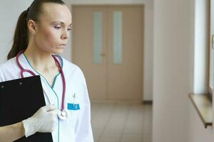 Young doctor after a stressful situation at working place photo