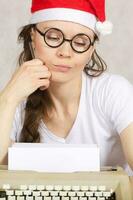 Young blogger with typing machine photo