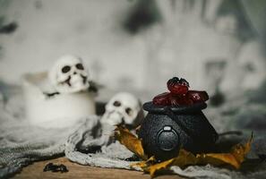 Candies in caldron for Halloween photo