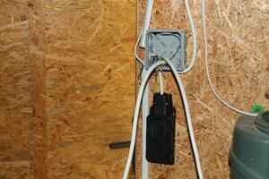 Installation of a junction box and an electrical outlet photo