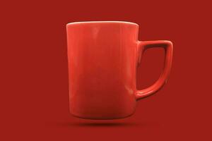 red coffee mug red background photo