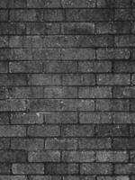 Brick wall made of gray bricks as background texture photo