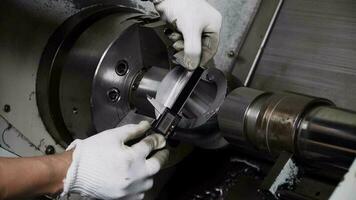 Quality control manufacturing.Hands of an engineer measures a metal part with a digital vernier caliper video