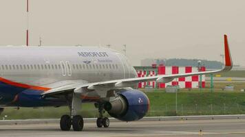 MOSCOW, RUSSIAN FEDERATION JULY 29, 2021 - Passenger plane Airbus A320 of Aeroflot taxiing at Sheremetyevo airport SVO. Airplane flight as a tourism and travel concept video