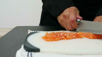 chef is cutting fresh salmon trout fillet prepare for making food, sushi sashimi cooking delicious famous asian japanese korean sea food video