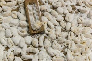 Handmade gnocchi  on the table. photo