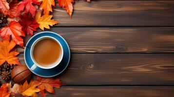 Leaves and pumpkin near fresh beverage. photo