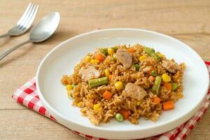 pork fried rice on white plate photo