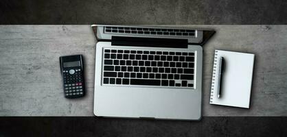 office stuff with tablet, laptop ,smartphone and coffee cup notepad and documents top view shot. photo