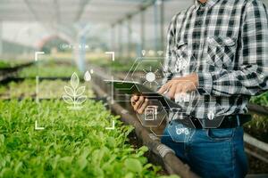 Smart farmer using application by tablet concepts modern agricultural technology and visual icon.Smart farming photo