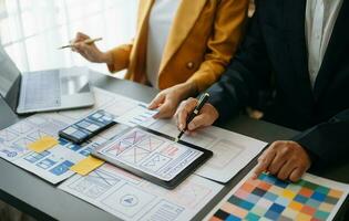 UX graphic designer planning application process development prototype wireframe for web smart phone. Creative digital development agency. photo