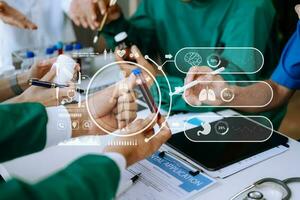 Medical technology network team meeting concept. Doctor hand working with smart phone modern digital tablet and laptop computer with graphics chart interface, with virtual icon diagram photo