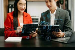 Cyber security and data protection. Business using computer and  tablet protecting business and financial data with virtual from cyber attack, cybersecurity technology in modern office photo