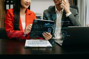 Cyber security and data protection. Business using computer and  tablet protecting business and financial data with virtual from cyber attack, cybersecurity technology in modern office photo