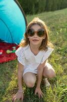 funny portrait of little baby girl wearing vintage colored glasses photo