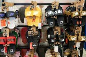 Samut Prakan, Thailand - July 2 2023 Various model of Nike's sandals in the shoe store. photo